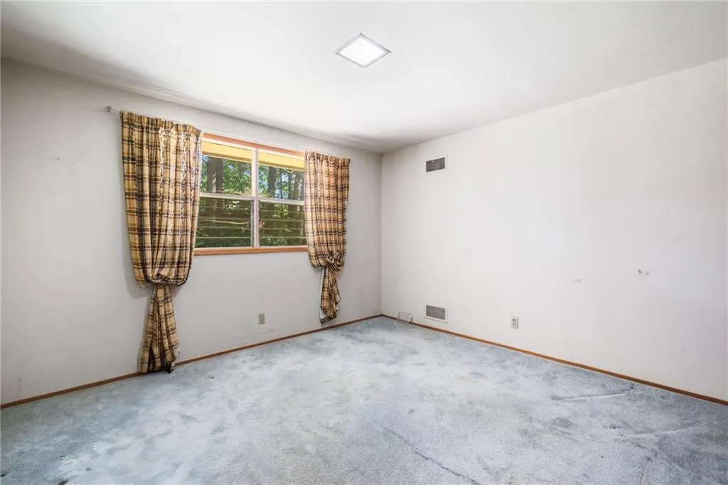 Spare room featuring carpet floors