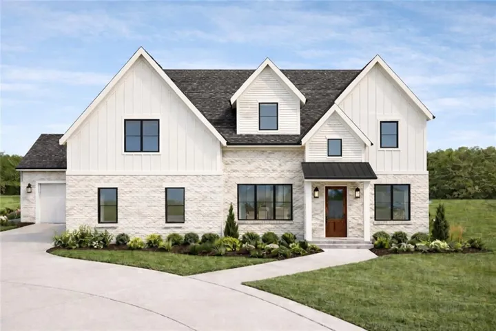 Modern farmhouse style home featuring board and batten siding, a front yard, roof with shingles, and driveway