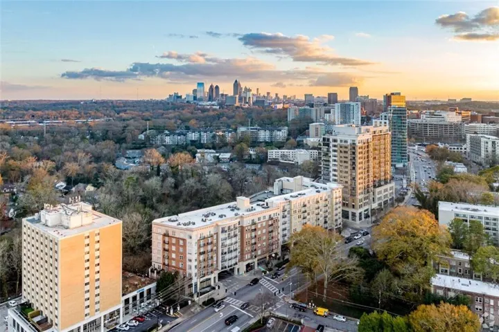 Urban landscape featuring a prominent cityscape in the background and multiple high-rise buildings