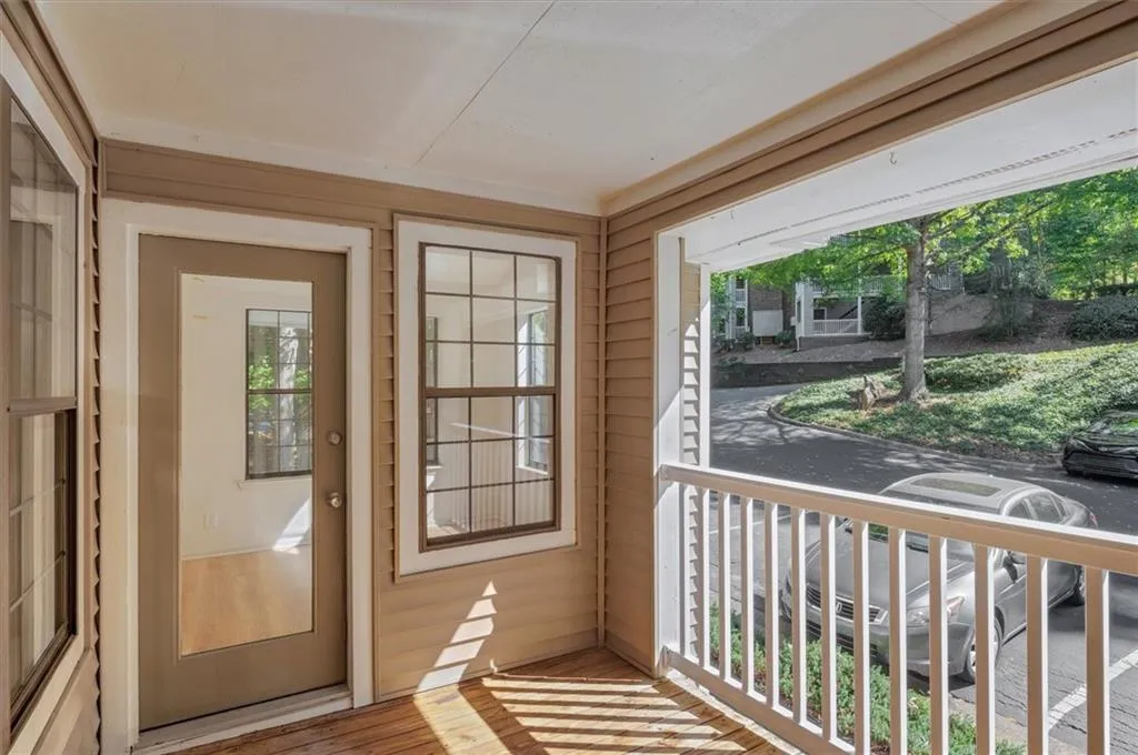 Entryway with wood walls and light wood-type flooring