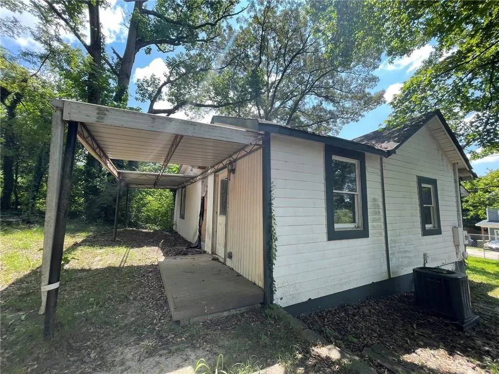 View of home's exterior with a central AC unit