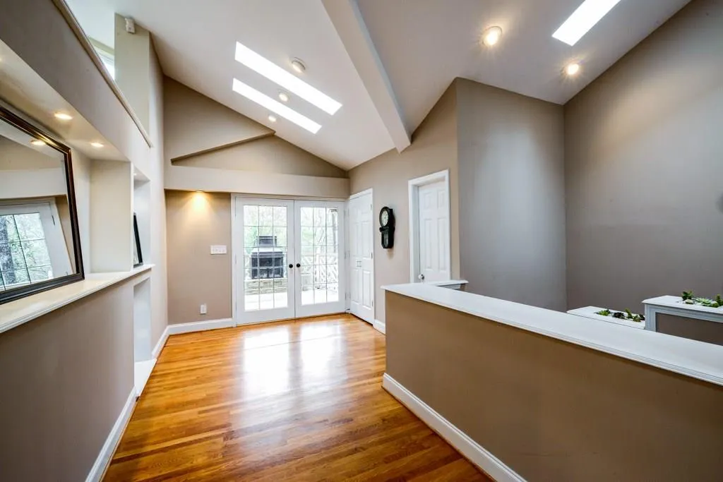 Entrance foyer showcases hardwood floors.