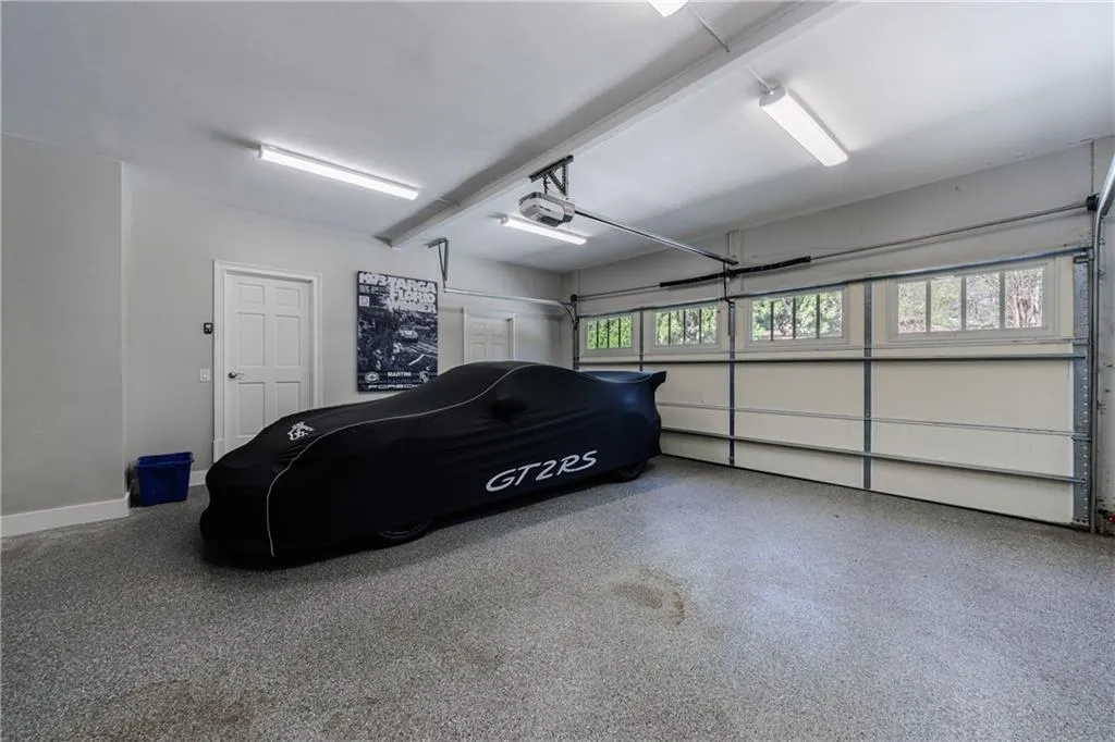 Double garage with epoxy 'granite' flooring, extra storage room, storage shelves