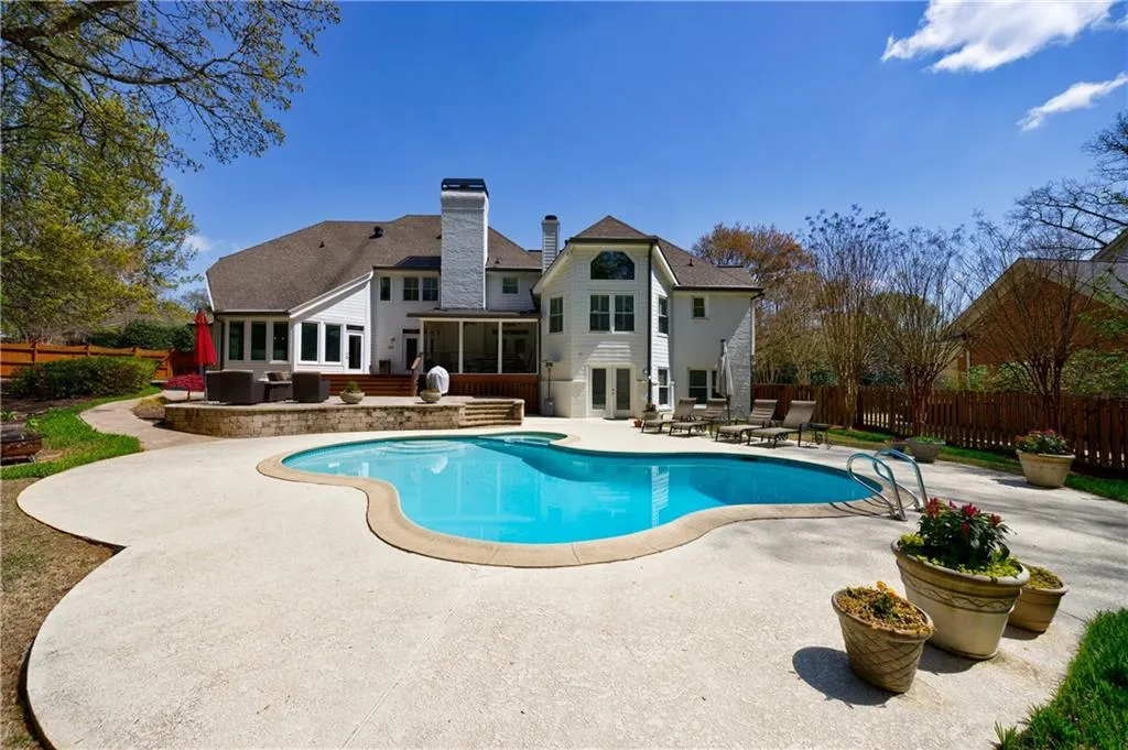View of swimming pool with a patio area