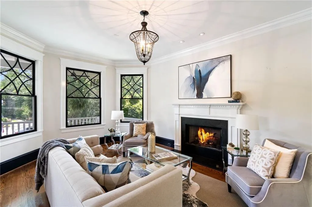 The formal fireside living room, just off the formal entry, boasts a gas fireplace, flawless hardwoods and is light and bright.