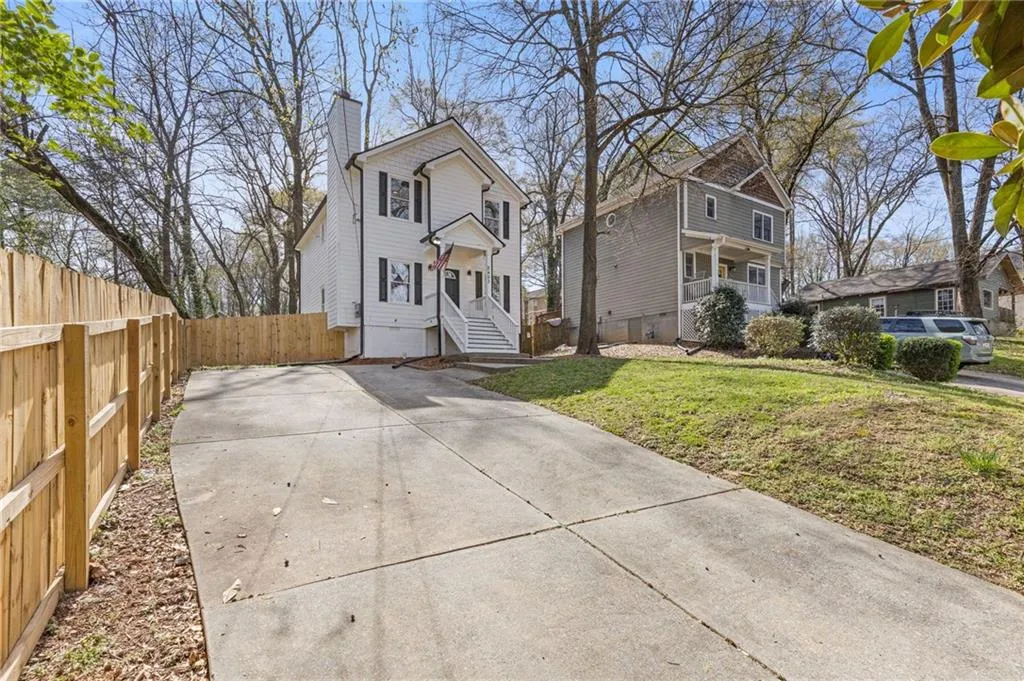 American foursquare style home featuring a chimney