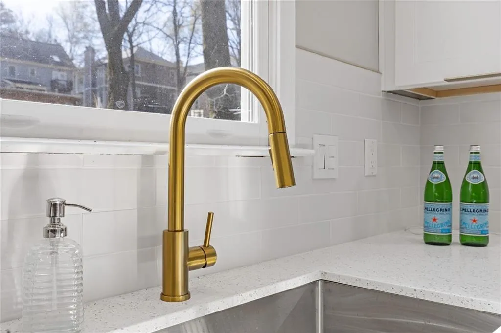 Kitchen view of backsplash and light stone countertops