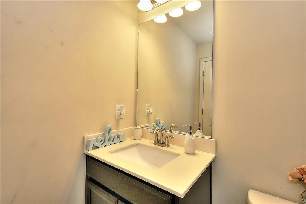 Full bath featuring vanity and shower / tub combo