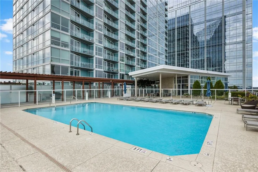 Community pool with a patio Community pool with a patio