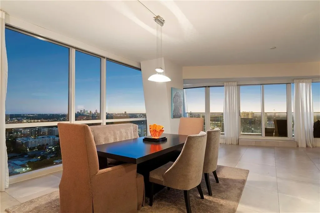 Dining area with a view of city and light tile patterned floors Dining area with a view of city and light tile patterned floors