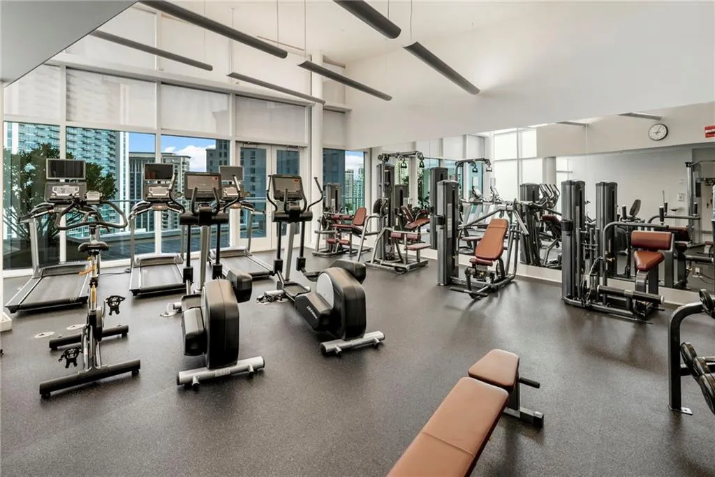 Gym featuring floor to ceiling windows Gym featuring floor to ceiling windows