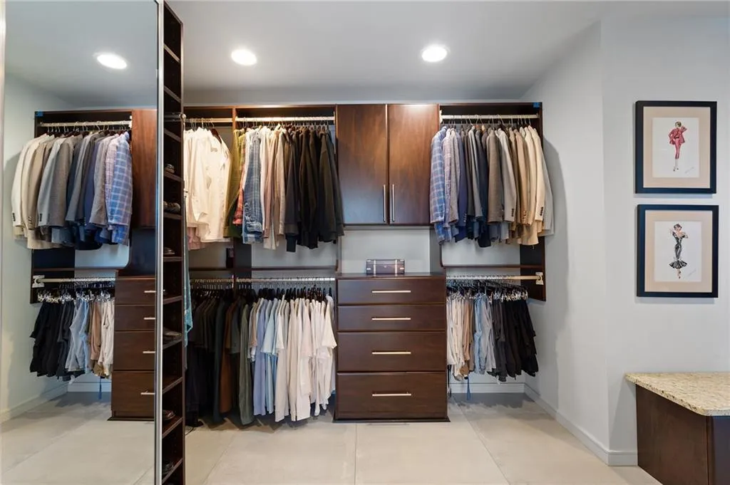 Walk in closet featuring light tile patterned floors Walk in closet featuring light tile patterned floors