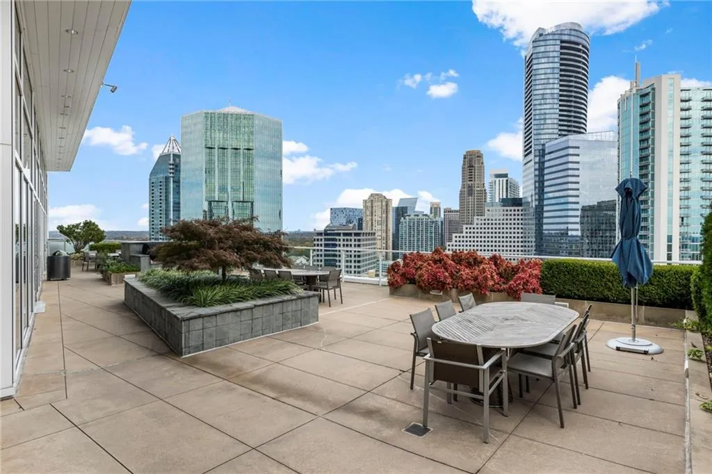 View of patio with outdoor dining area and a view of skyline View of patio with outdoor dining area and a view of skyline