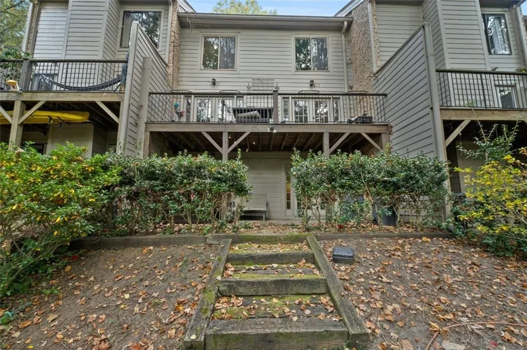 Deck and patio with stairs to walking trail