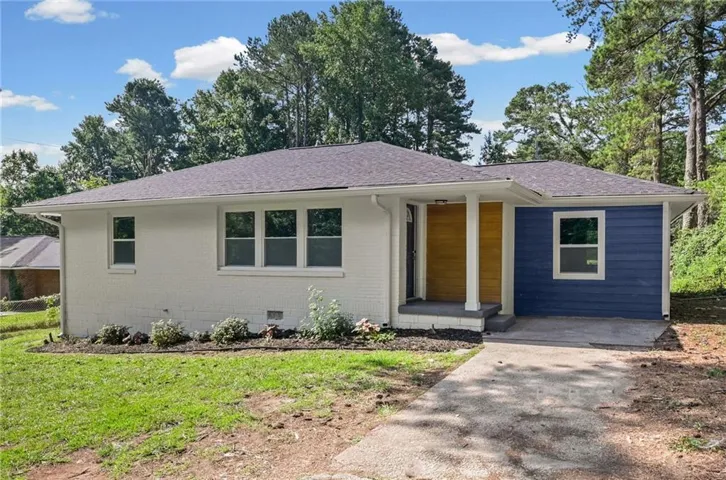 Ranch-style residence featuring a combination of white painted brick and blue horizontal siding