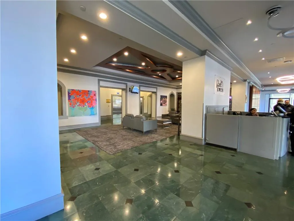 Reception area with visible vents and arched walkways