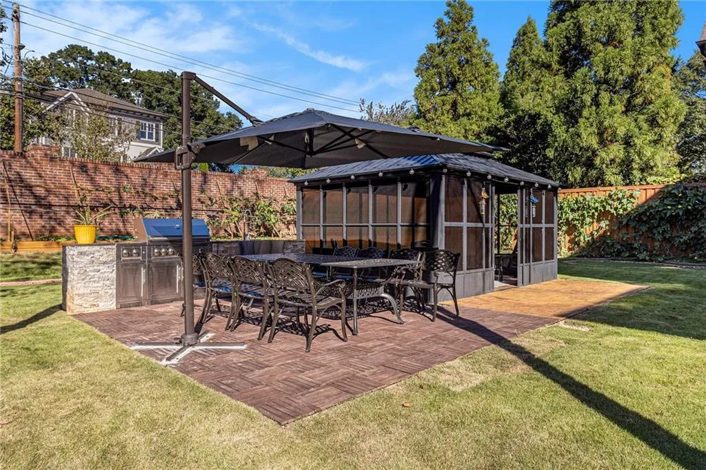 Full, outdoor kitchen and dining area
