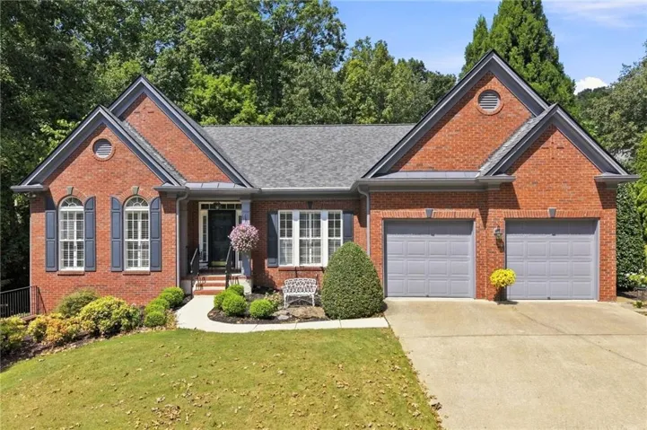 Brick exterior with dual gables and a shingle roof