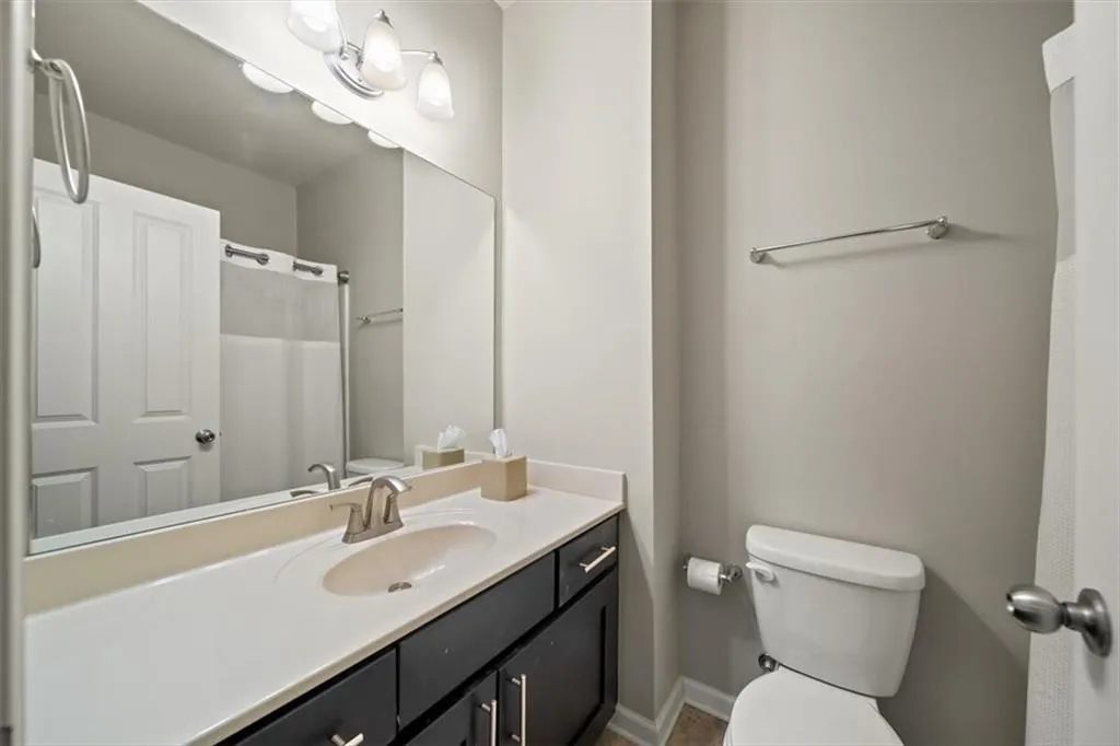 Bathroom featuring vanity and toilet