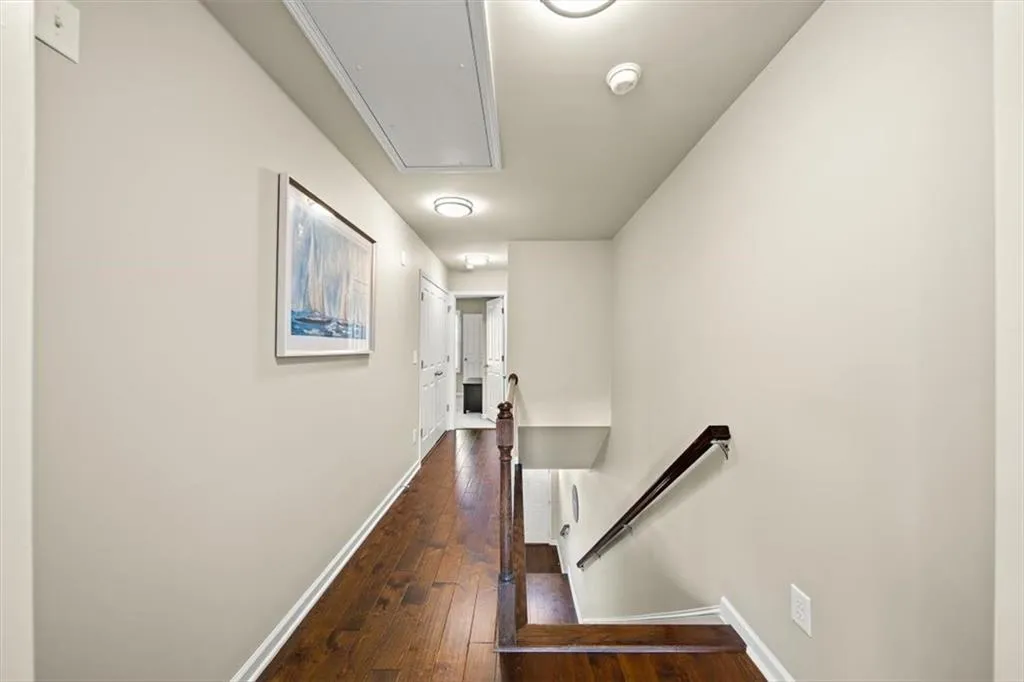 Hallway featuring dark hardwood / wood-style floors