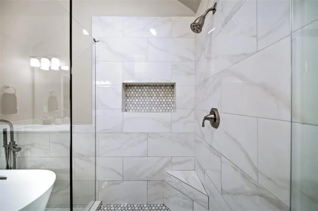 Bathroom featuring independent shower and bath and sink