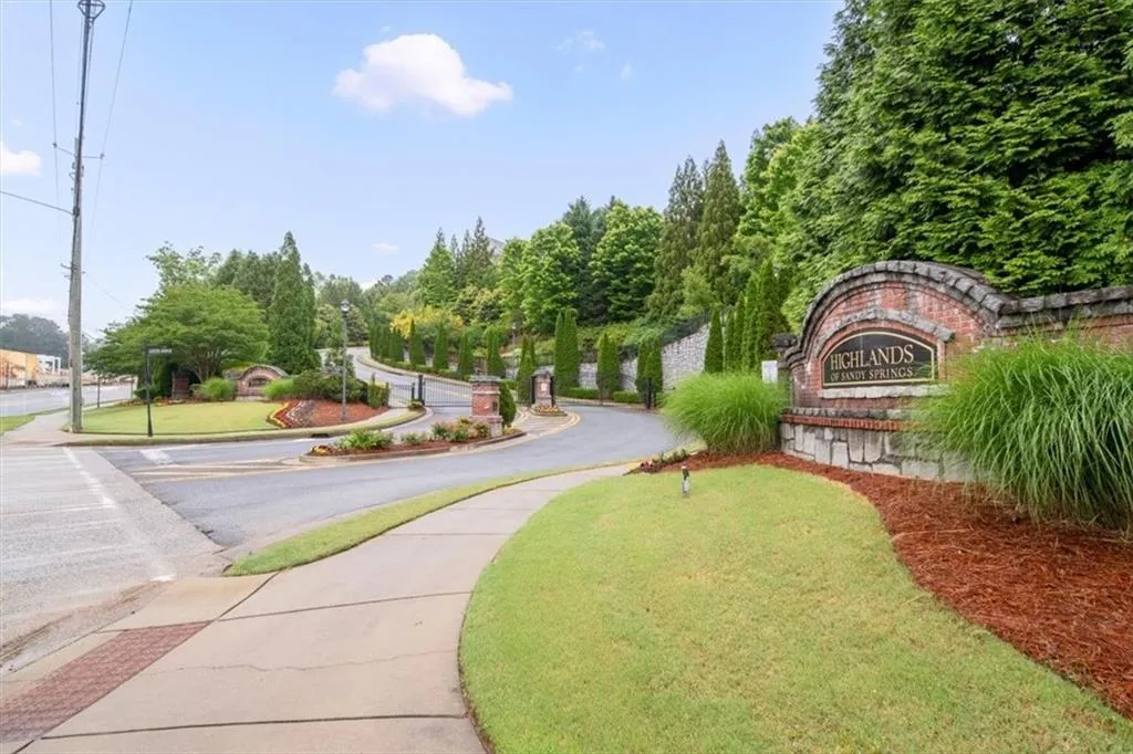 View of property's community featuring a lawn