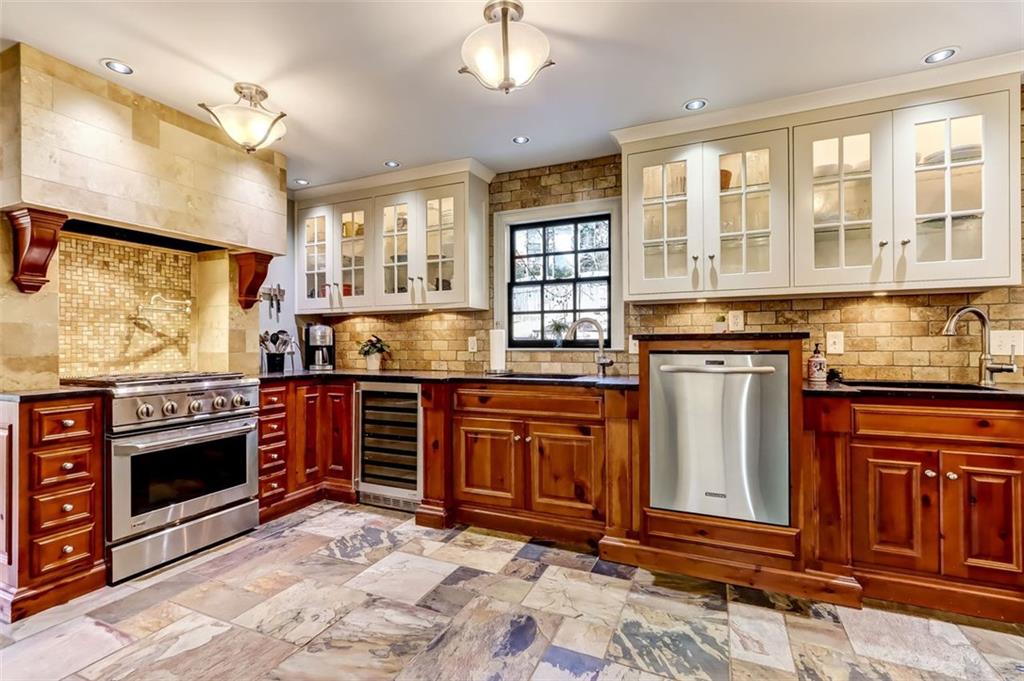 View of the Kitchen's smart functionality, notice both sinks with Disposals