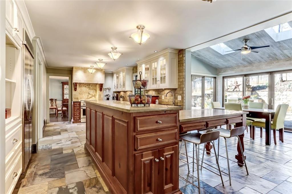 View from garage entry includes flow into the Sunroom and beyond!