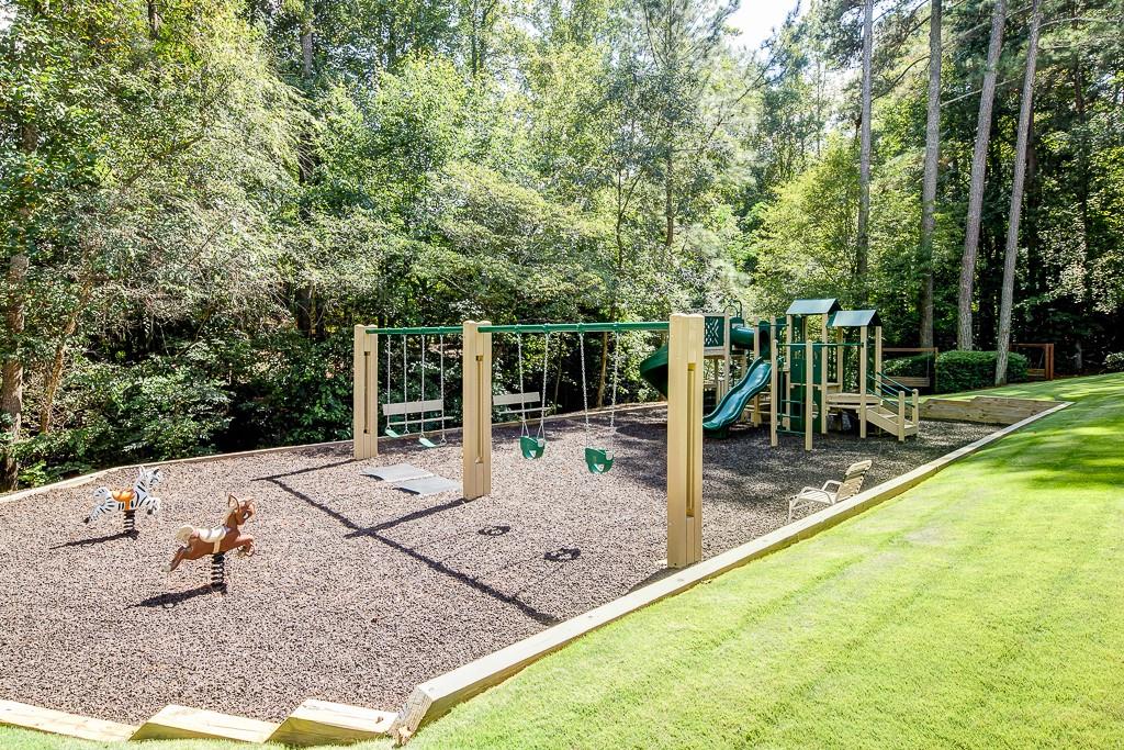 View of playground with a yard