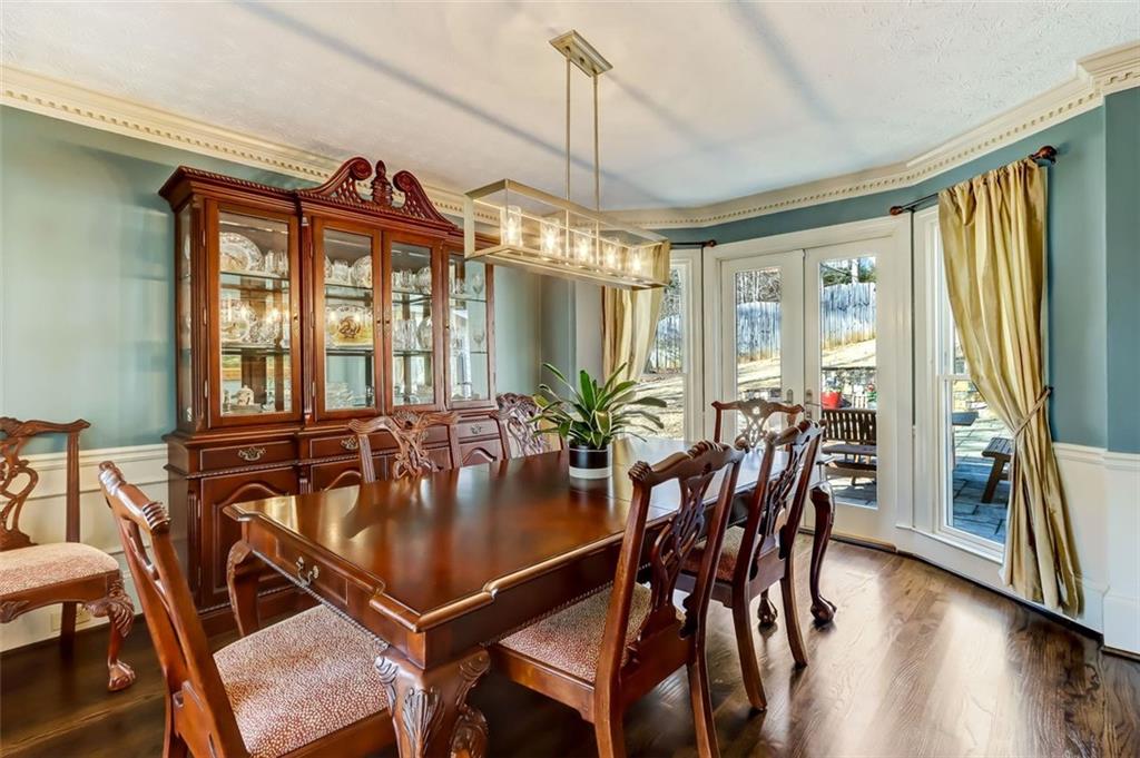 View of Dinning room & French Doors to the Backyard Patio from the Living Room