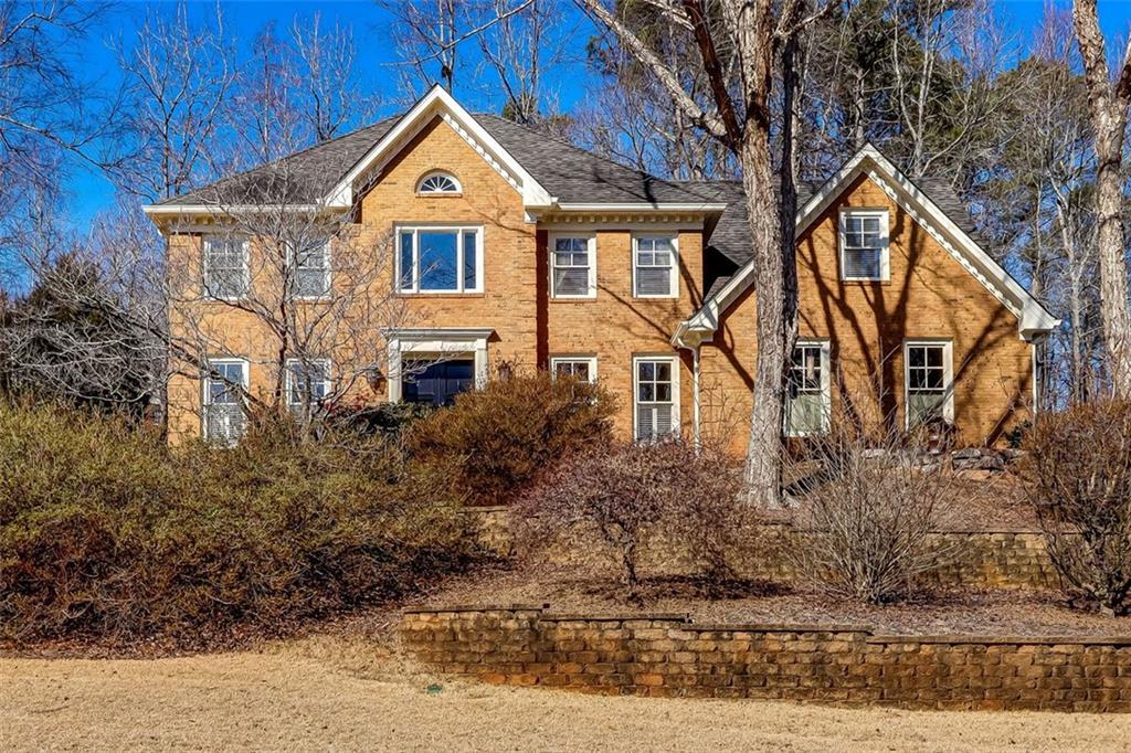 Great Deerfield home Sits beautifully atop of sloped corner culdesac lot