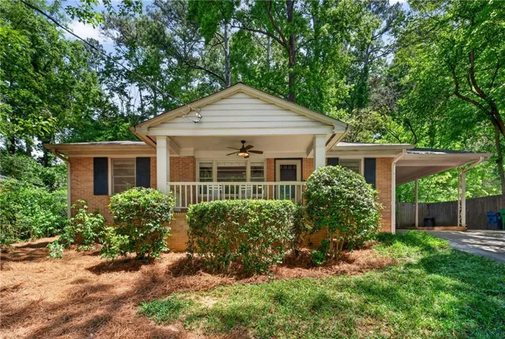 This gem features a brick exterior and covered front porch, located in a wonderful established neighborhood.