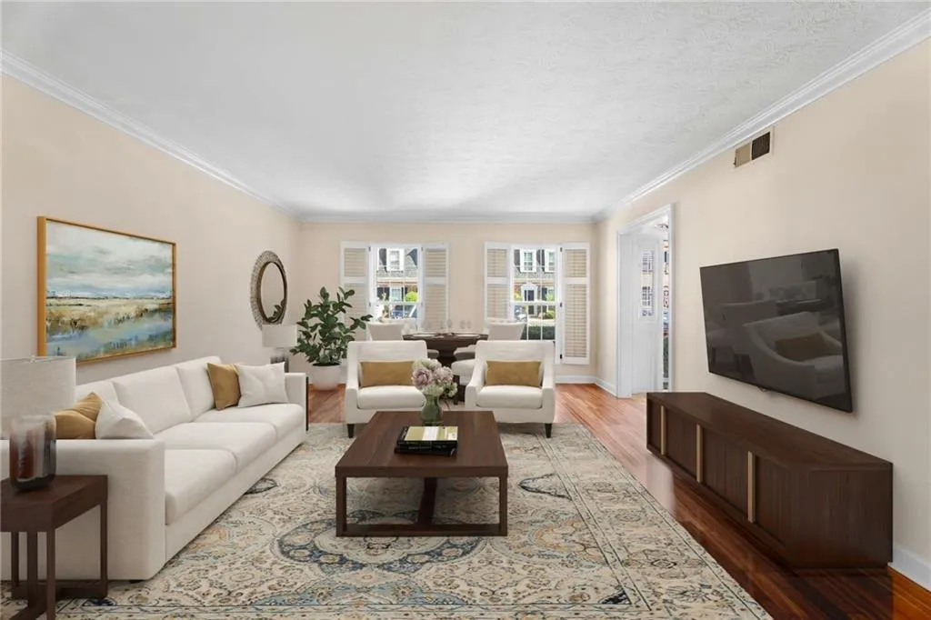Large Living room with large windows. Virtually staged