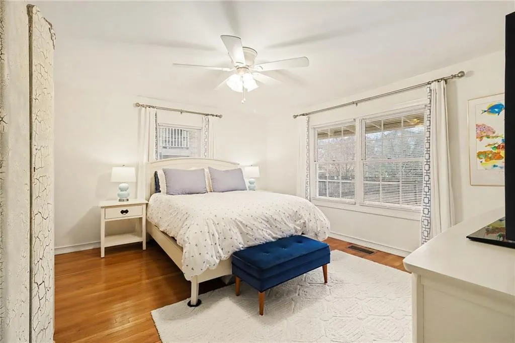 Bedroom with light wood-type flooring and a ceiling fan