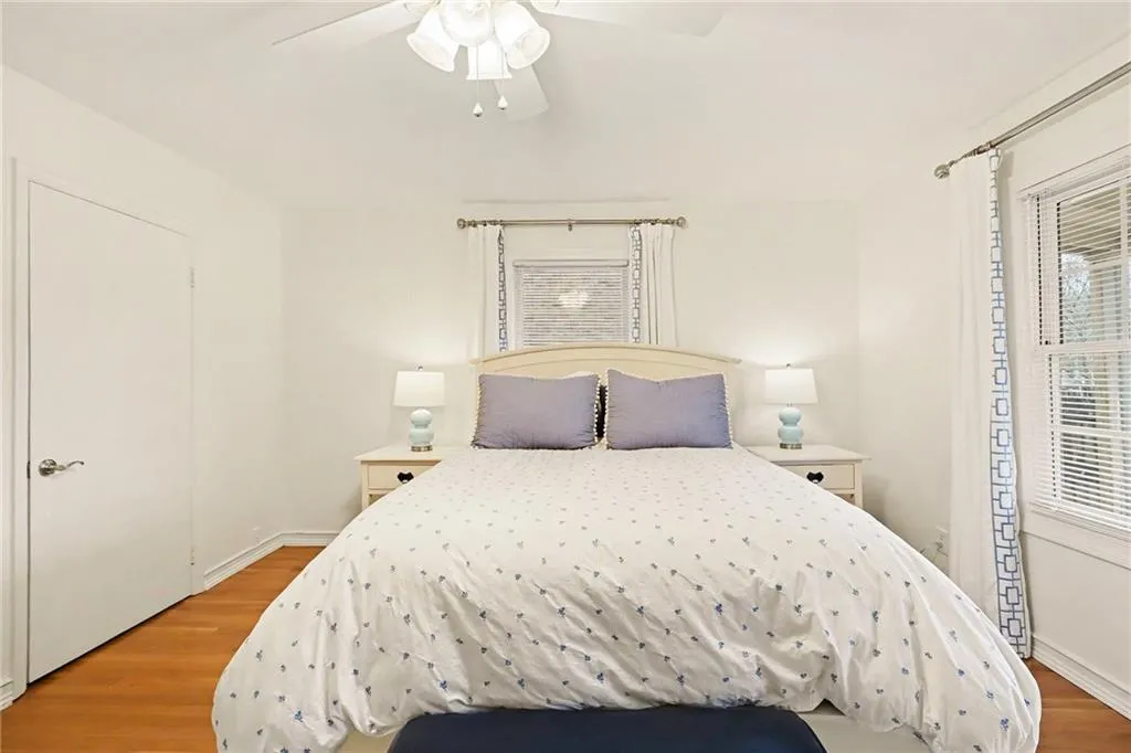 Bedroom featuring wood finished floors and ceiling fan