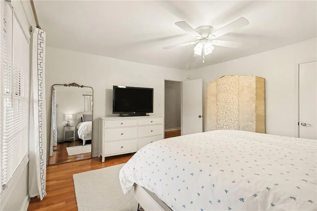 Bedroom featuring wood finished floors and ceiling fan