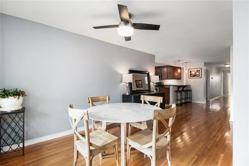 Dining space featuring light wood-style flooring and a ceiling fan