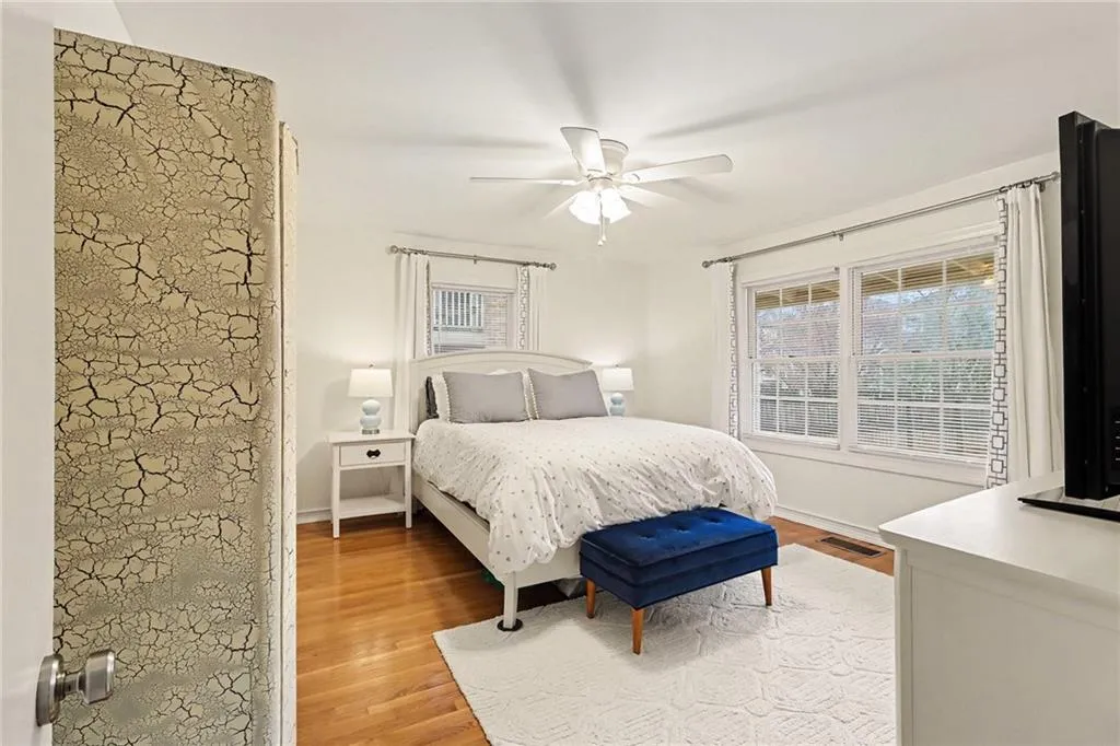 Bedroom with light wood finished floors and ceiling fan