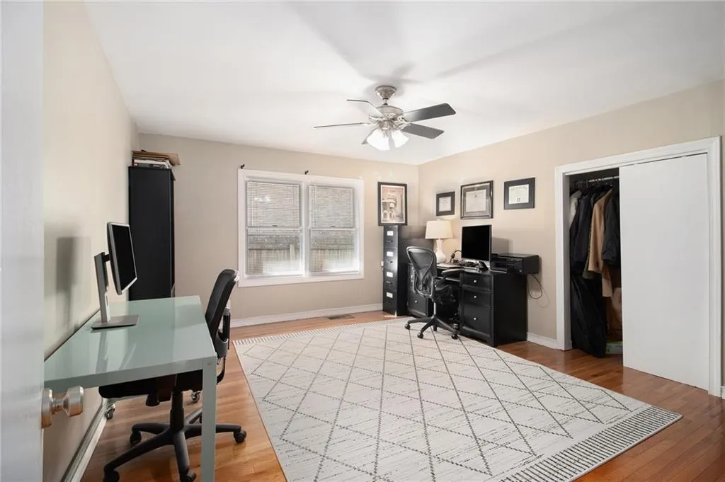 Office featuring a ceiling fan and light wood-style floors