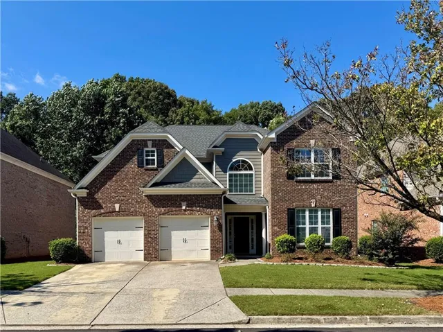 Brick and siding facade with gabled roof lines