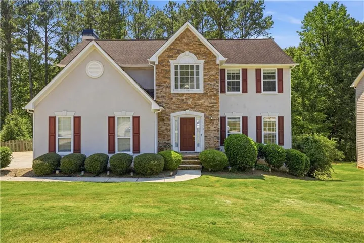 Front home featuring well-manicured landscaping