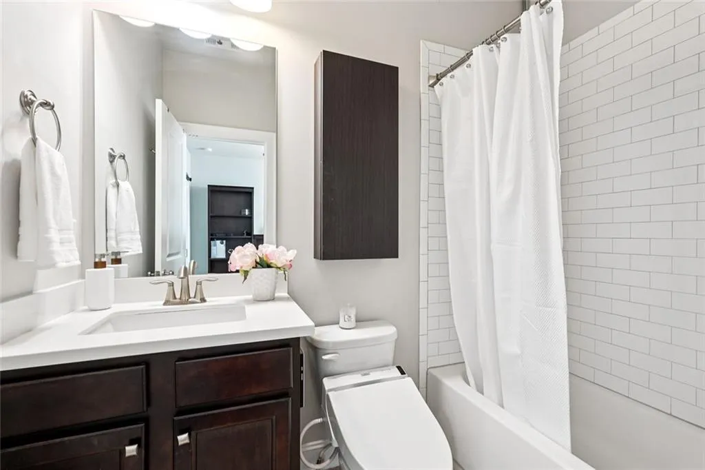 Ensuite bathroom with tub for upstairs bedroom