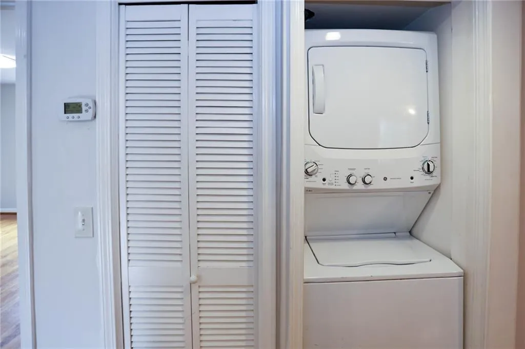 Laundry area featuring stacked washer/dryer