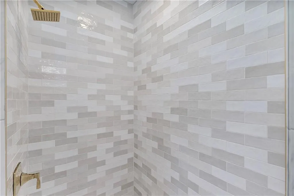 Bathroom view of a tile shower