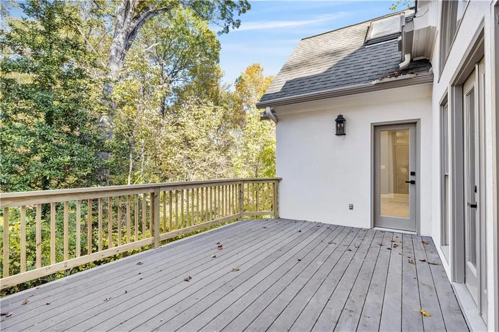 Deck featuring view of scattered trees