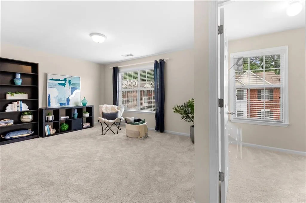 Also on the 3rd level and opposite the primary suite across the hallway, is a second very large, light-filled bedroom with ensuite bath and a huge walk-in closet with a window.