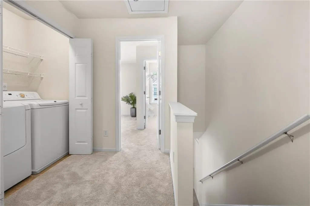 Laundry area with double doors, is located on the 3rd floor hallway.