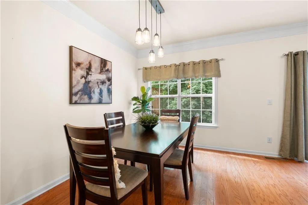 Spacious dning area with ornamental molding opens to both the kitchen and great room