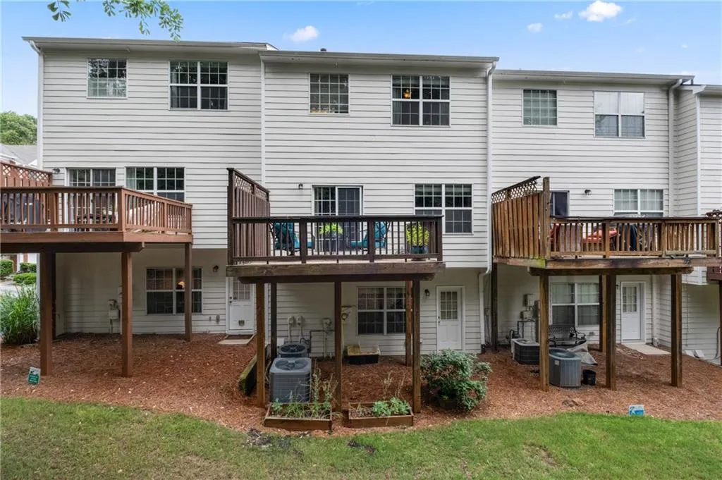 Another view of the back of the home with private deck