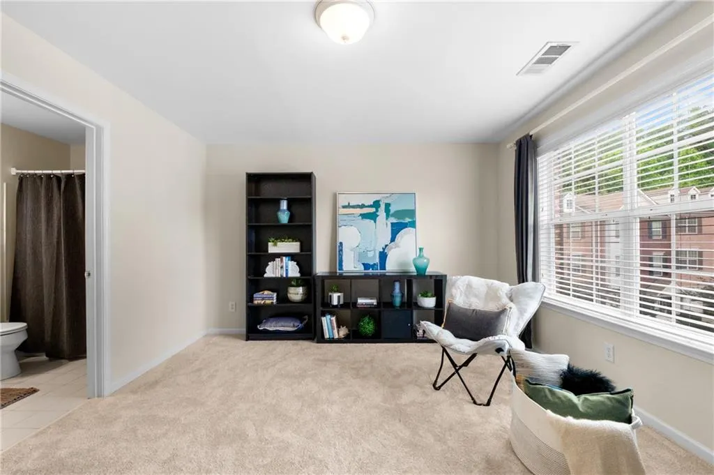View of upstairs bedroom with view to the ensuite bath